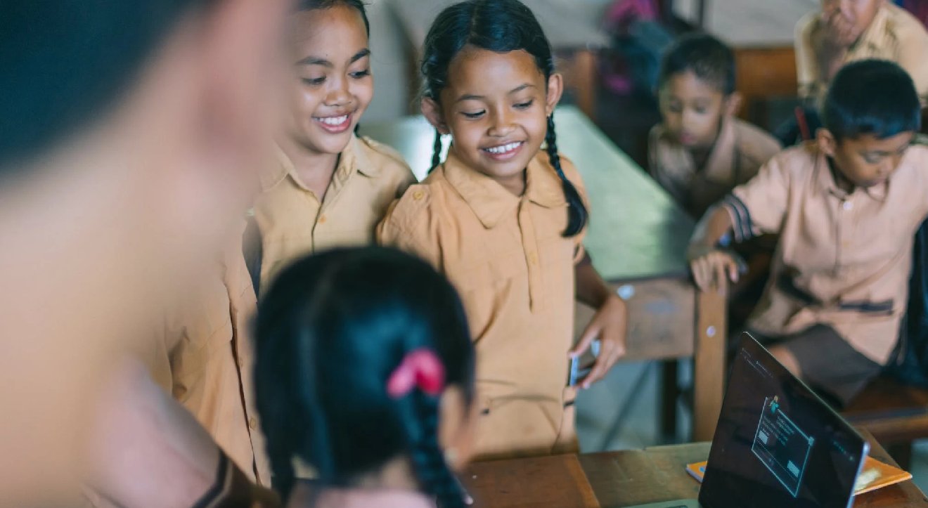 Children looking at a computer